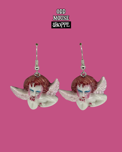 A top view of the painted earrings