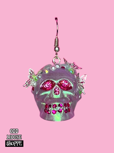 A front view of the skull earring