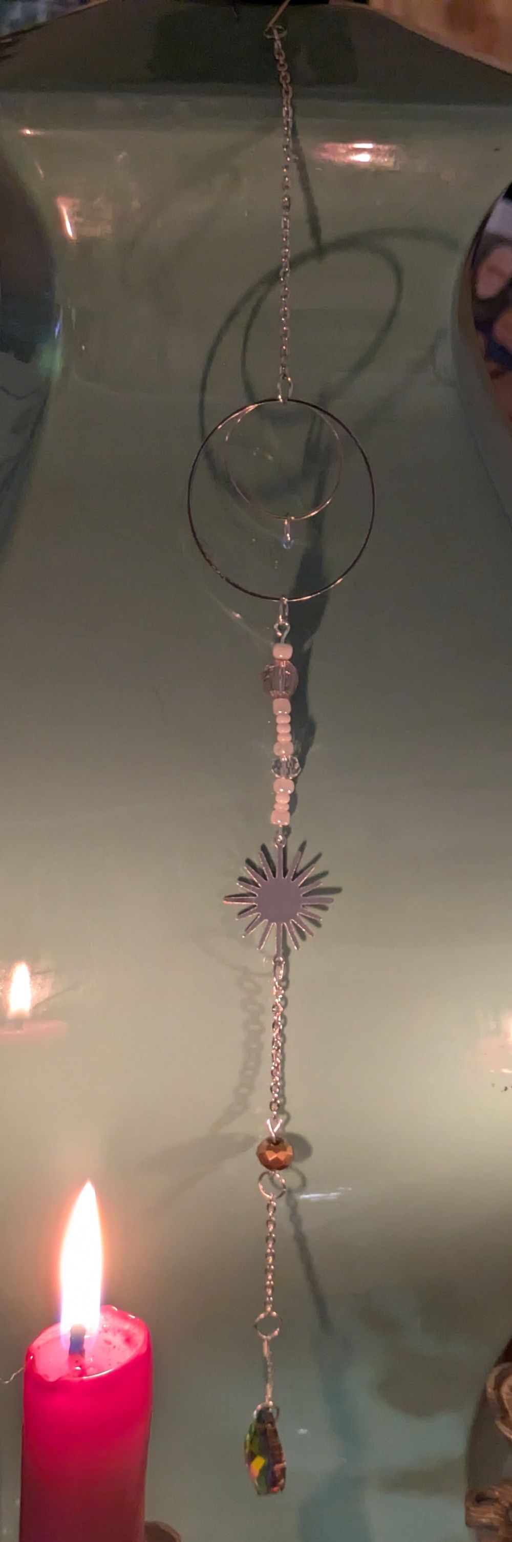 Solar system themed sun catcher symbolizing orbiting celestial beings