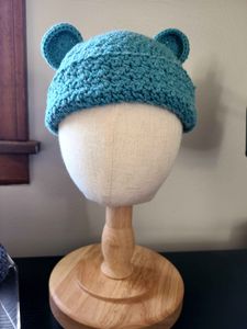 Baby beanie with bear ears in the 12-month size, in the color Teal (12) from the Acacia yarn swatch options.