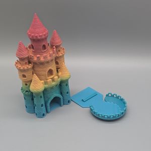 The tray slides out so it can't accidently snap off if you travel with the tower.