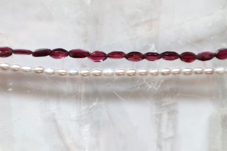 A closer look at the marquise garnet beads and freshwater pearls on the Garnelle Necklace