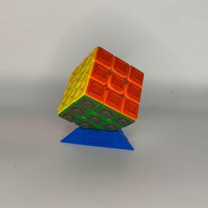 Turn it Tactile Speed Cube displayed on Turn it Tactile branded cube stand 