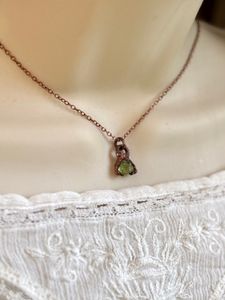 Small, dainty raw peridot copper electroformed pendant on 14” chain