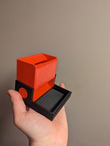A small, collapsible dice tower