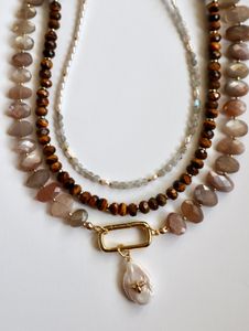 A trio of Auréad Designs necklaces.