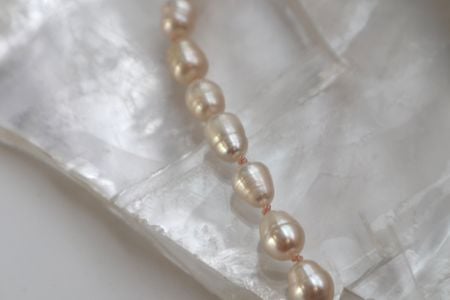 Closer look at the freshwater pearls and silk knotting on the Siena Necklace.