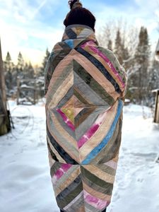 Polychrome wrapped around my back, staring off into the winter landscape