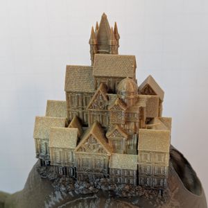 A closer shot of the small town on the back of the snail.