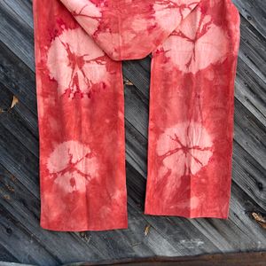 Red Madder Spiderweb scarf hanging on a wall 