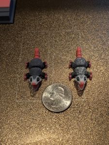 The earrings with a quarter for scale. They're not much larger than the quarter.