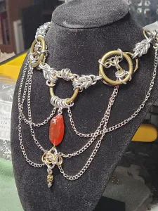 A slight angle shot of the necklace on a necklace display form
