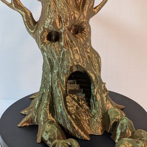 A closer look at the skull-like face of the tree. You can see the hollow eyes and the outline of where a nose "used" to be, above a large hole that looks like a screaming mouth.