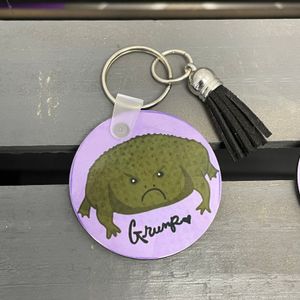 Grump Frog w/Black Tassel Side 1