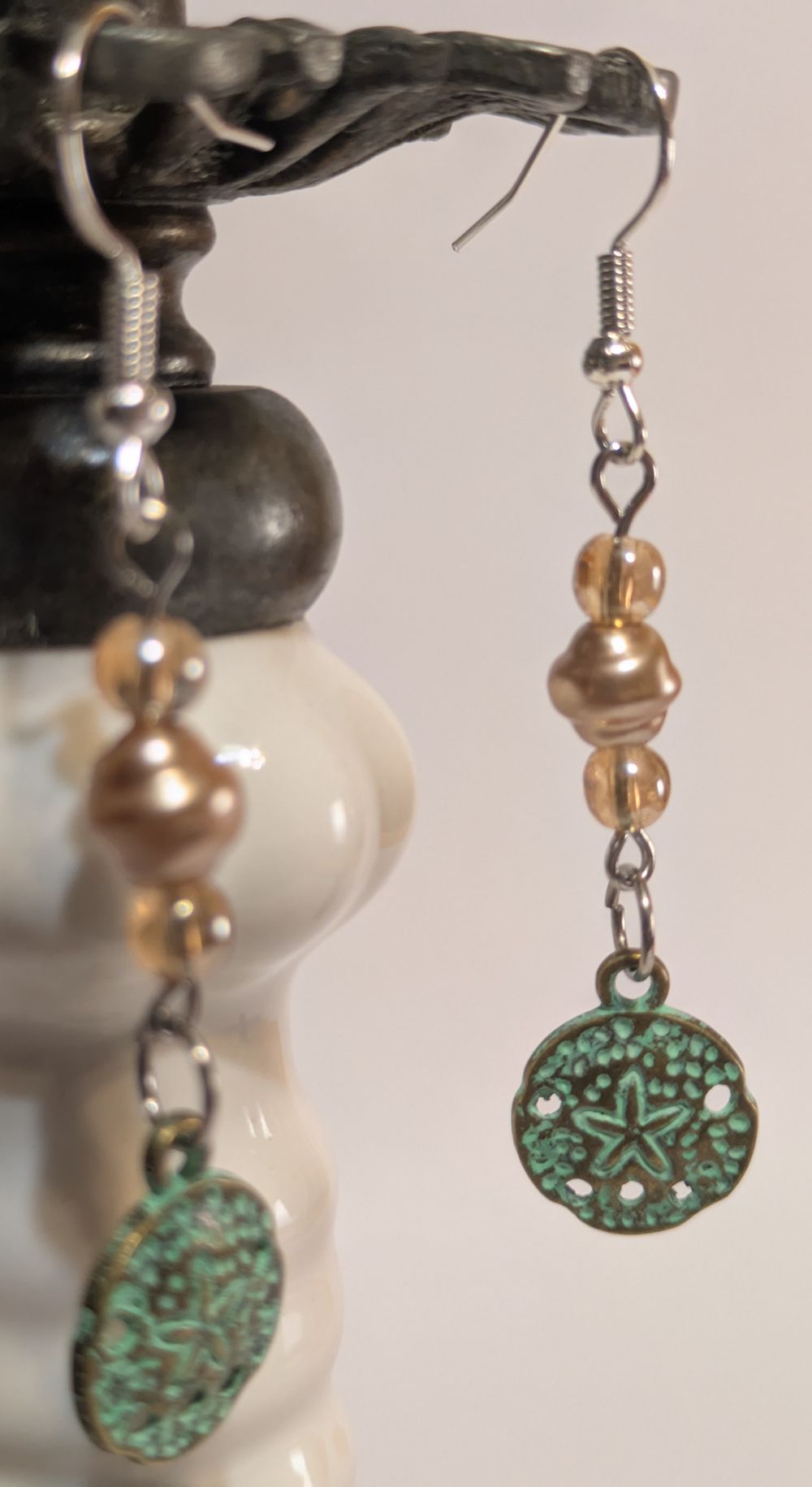 Sand dollar earrings with faux pearl bead accent