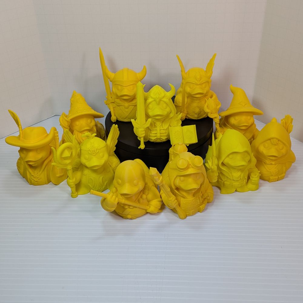 All of the 3d printed ducks in one photo, all grouped together.