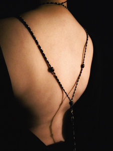 Secondary back view of the menat while worn.