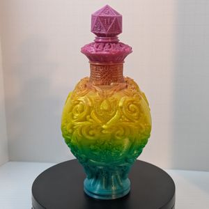 A side view of the 3D printed heart shaped bottle, showing the scrollwork adorning it.