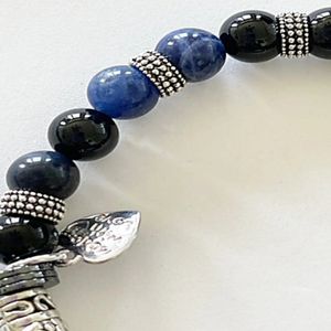 8" - Ebony blackwood, indigo or red tigers eye, and blue lapis lazuli with base metal spacers