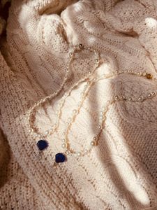 The Blue Shell Pearl Necklaces in the sunlight