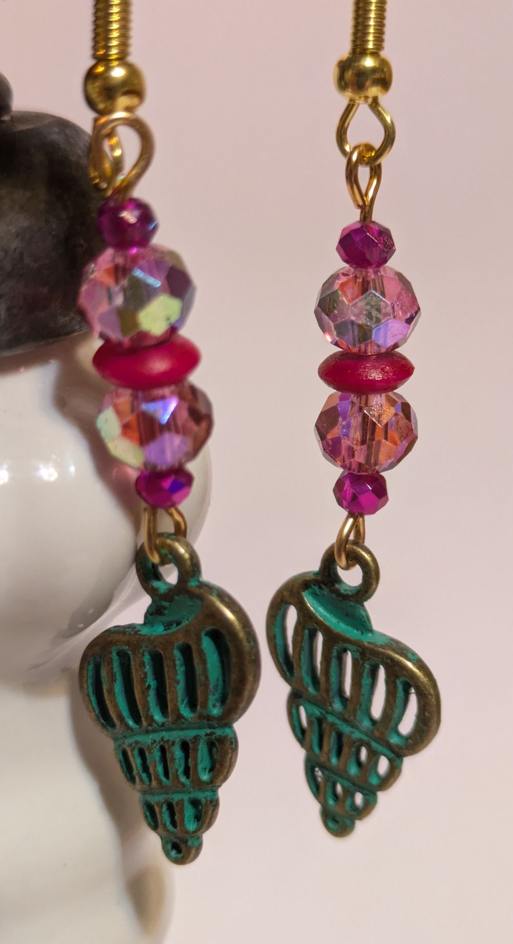 Patina shell earrings with vintage pink bead accents