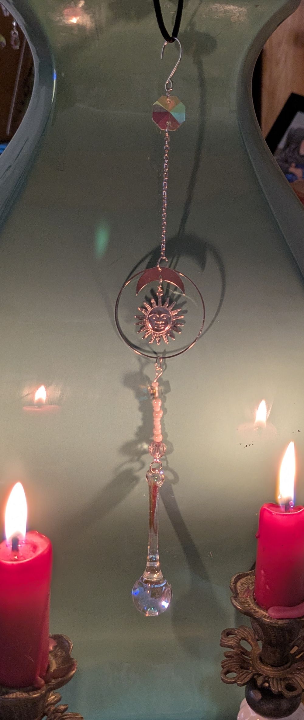 Light catcher with sun and moon accent. 2.5" tear drop weight