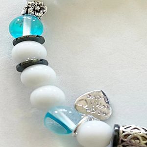 7" - Blue mermaid, snow jade, and hematite with base metal spacers