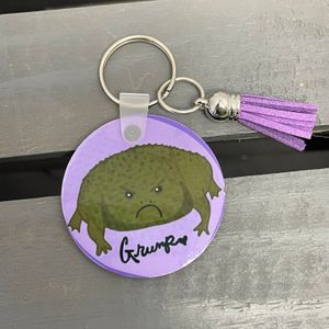 Grump Frog w/Purple Tassel Side 1