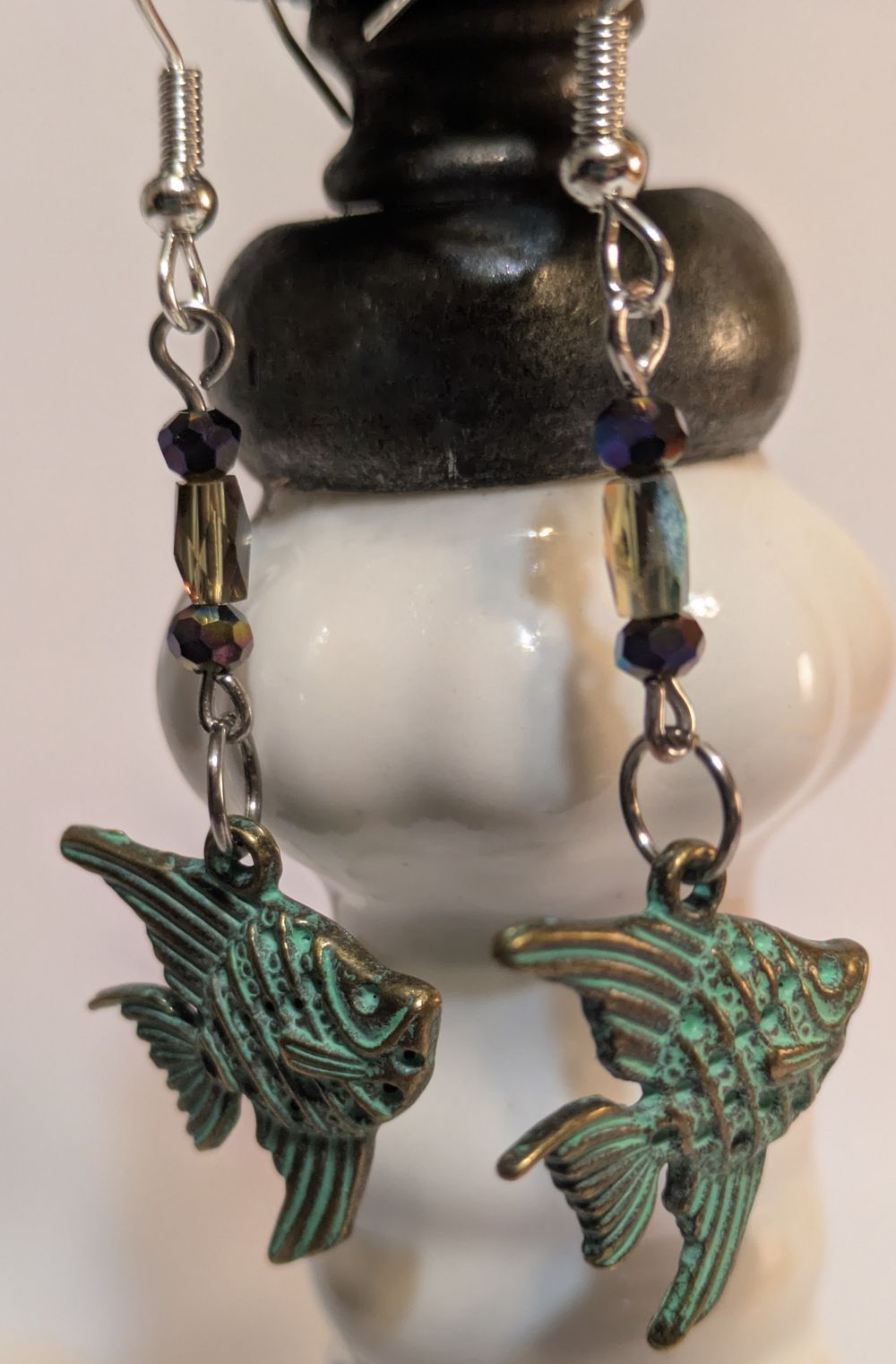 Angelfish charmed earrings with patina and glass bead accent...