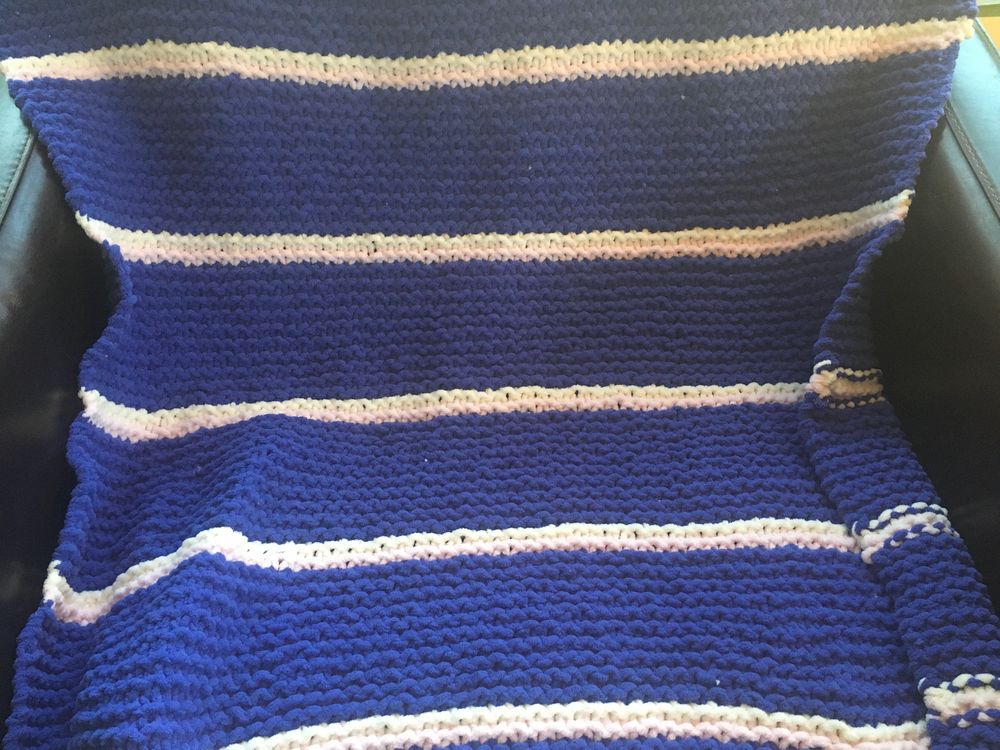 Cozy blue blanket with pinstripes 
