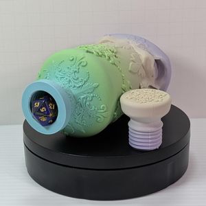 A 3d printed bottle, laying on its side. Beside it is the screw off top, and inside the mouth of the bottle is a standard size d20, which is almost completely filling the mouth.