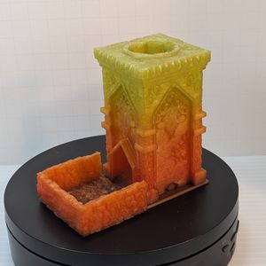 A version of the tower that is a yellow at the top, going down to an orange at the bottom.