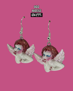 A side view of the pair of earrings