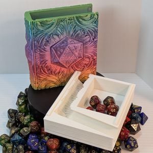 The 3D printed tome with the pages insert removed. It shows the L-shaped dice tower going down thee side and sloping at the bottom, and the small section to hold a set of dice in the right hand corner of the insert.