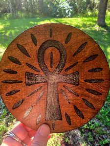 Detail of side picturing the Ankh in sunlight