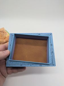 A closer look at the chrome tan leather insert adhered in the bottom of the box.