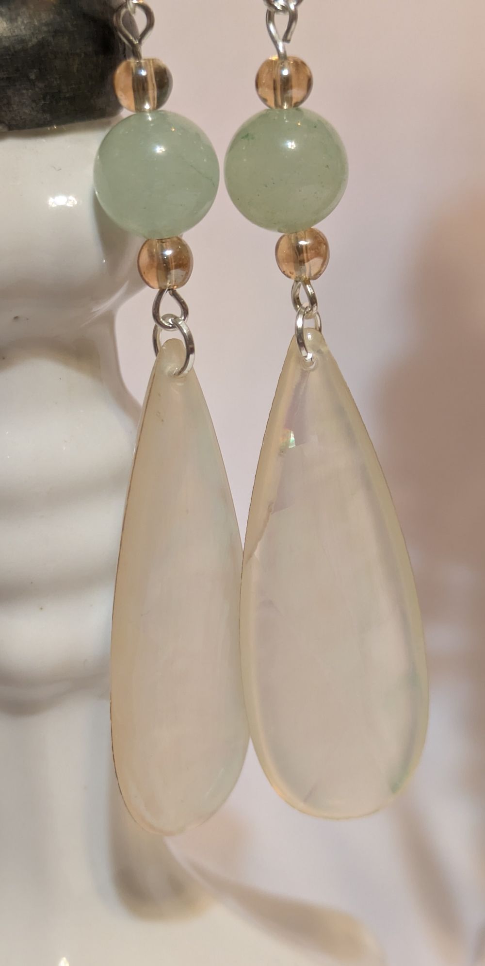 Opalescent-finished dangling resin earrings