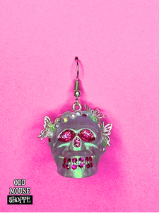 One of the earrings facing forward