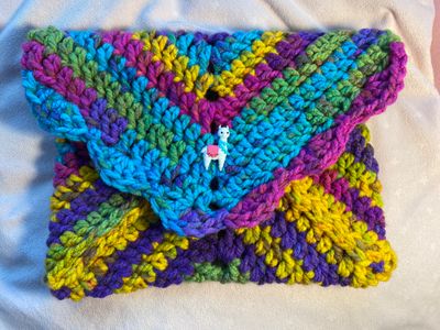 Aqua, pink, purple, green, and yellow with Llama button