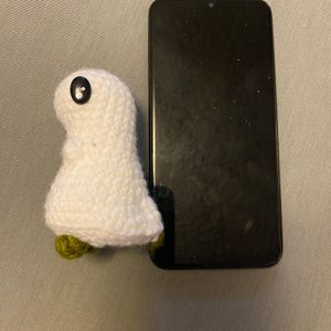 Ghostie boi next to phone left side