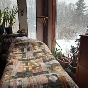 Fingerprints spread out on a twin sized bed