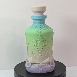 The side of the 3d printed bottle. At this angle, you can't tell the base is a skull, and it's just pretty decorative work.