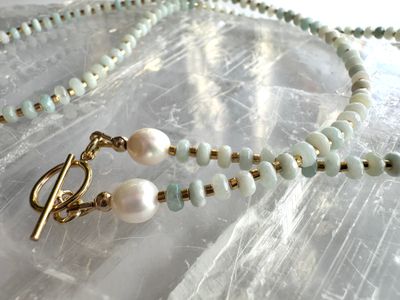Close up details on the amazonite, freshwater pearls, and 14k gold-filled toggle clasp on the Amara Necklace