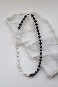 The Tashira Necklace mad with clear quartz, hematite, and peacock black freshwater pearls