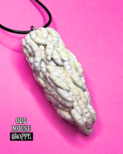 The other side of the sculpted pendant.