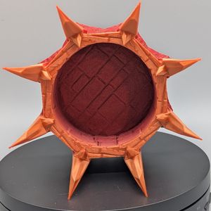 A look inside the dice cup, showing the pattern of brick flooring inside the bottom of it.