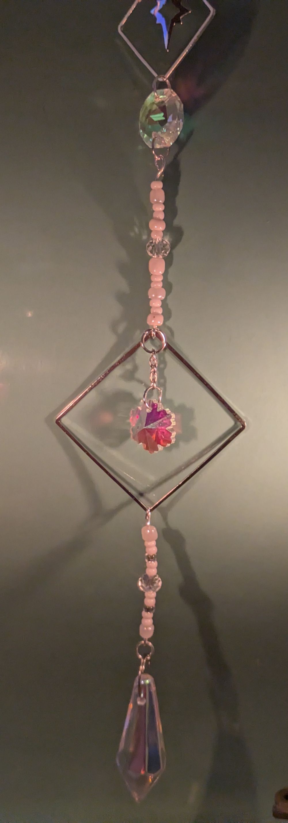 Star themed sun catcher with square framed glass accent and pointed glass crystal weight