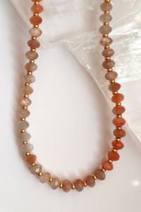 A closer look at the faceted rondelle peach moonstone beads on the Calida Necklace