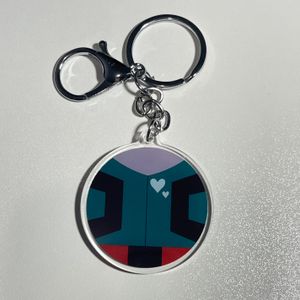 keychain with design of Deku’s hero suit and silver clasp on white tabletop