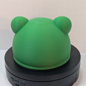 The back of the 3d printed froggy catch-all tray. It's round and green.